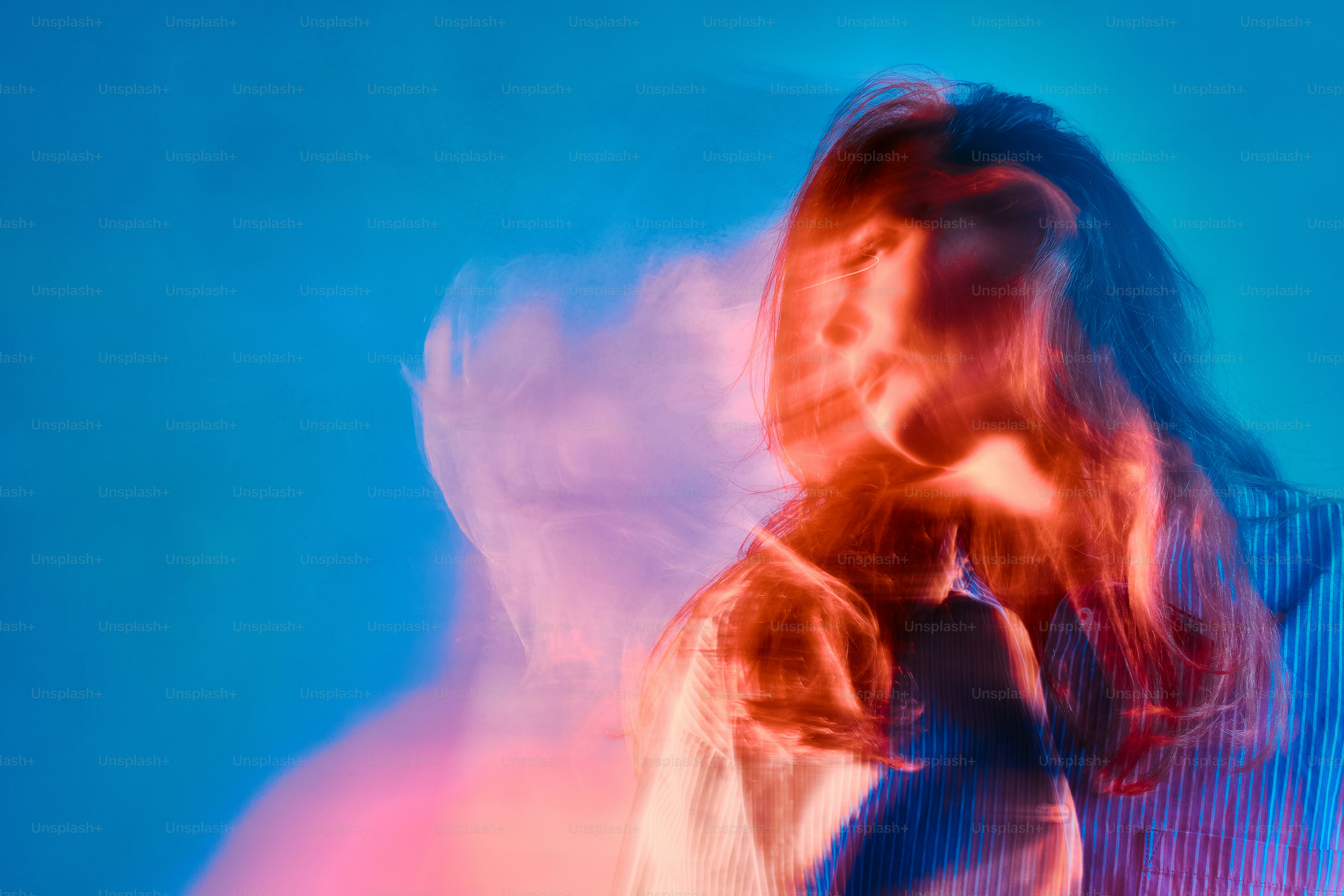 a blurry photo of a woman with long hair