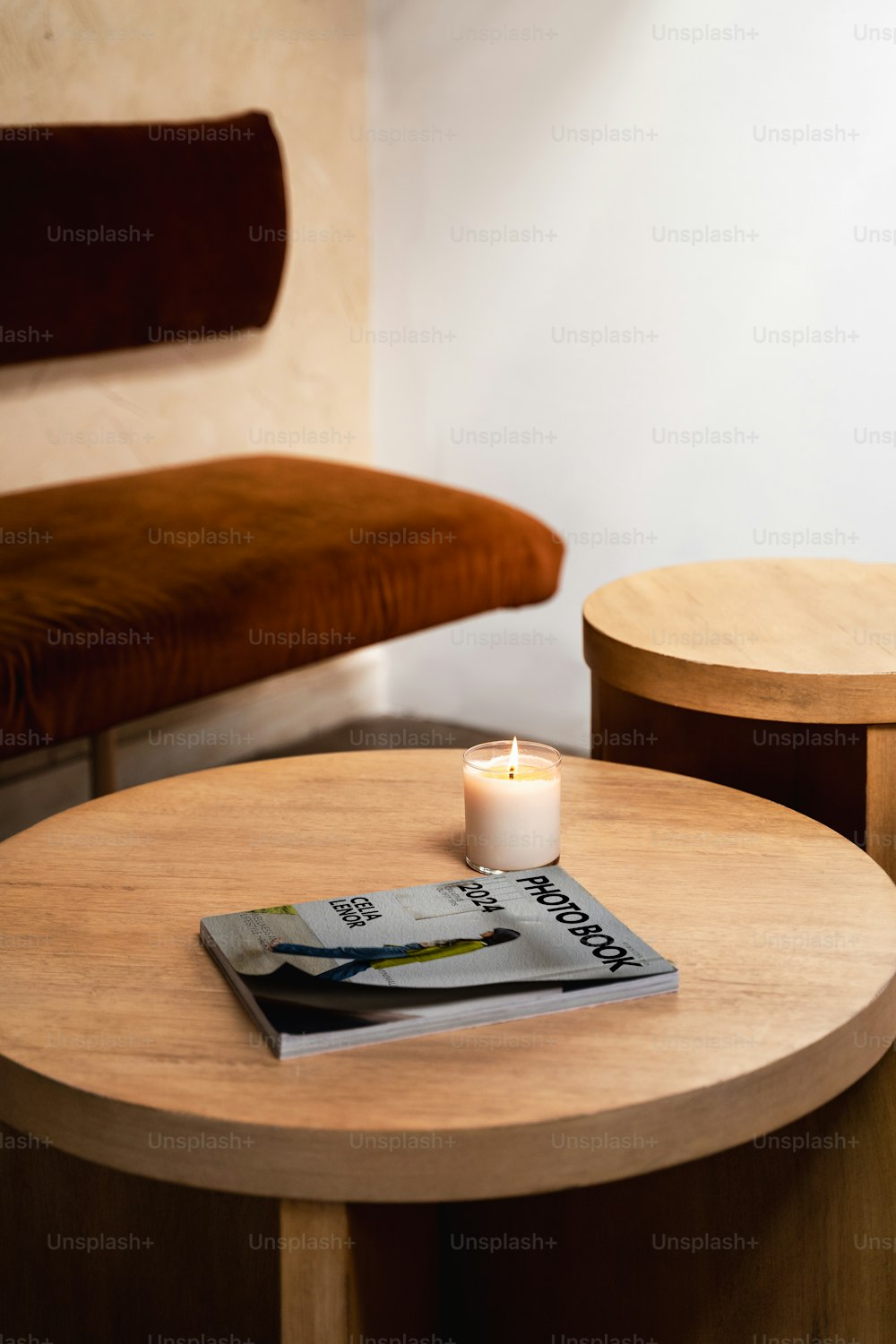 a table with a book and a candle on it