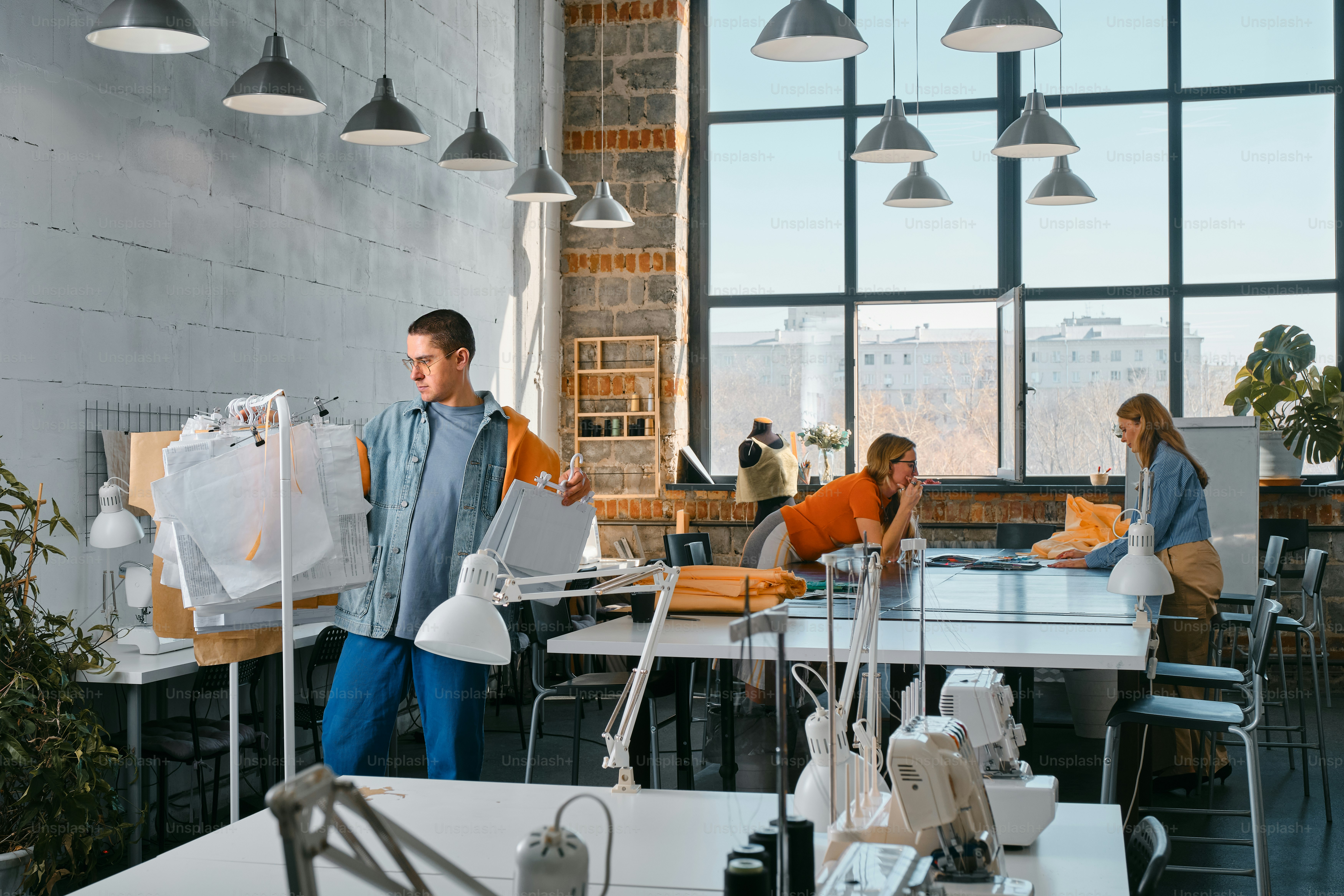 a group of people working in a large office