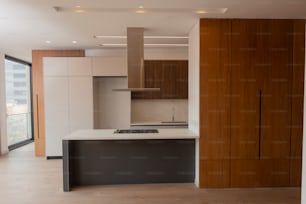 a kitchen with a stove top oven next to a window