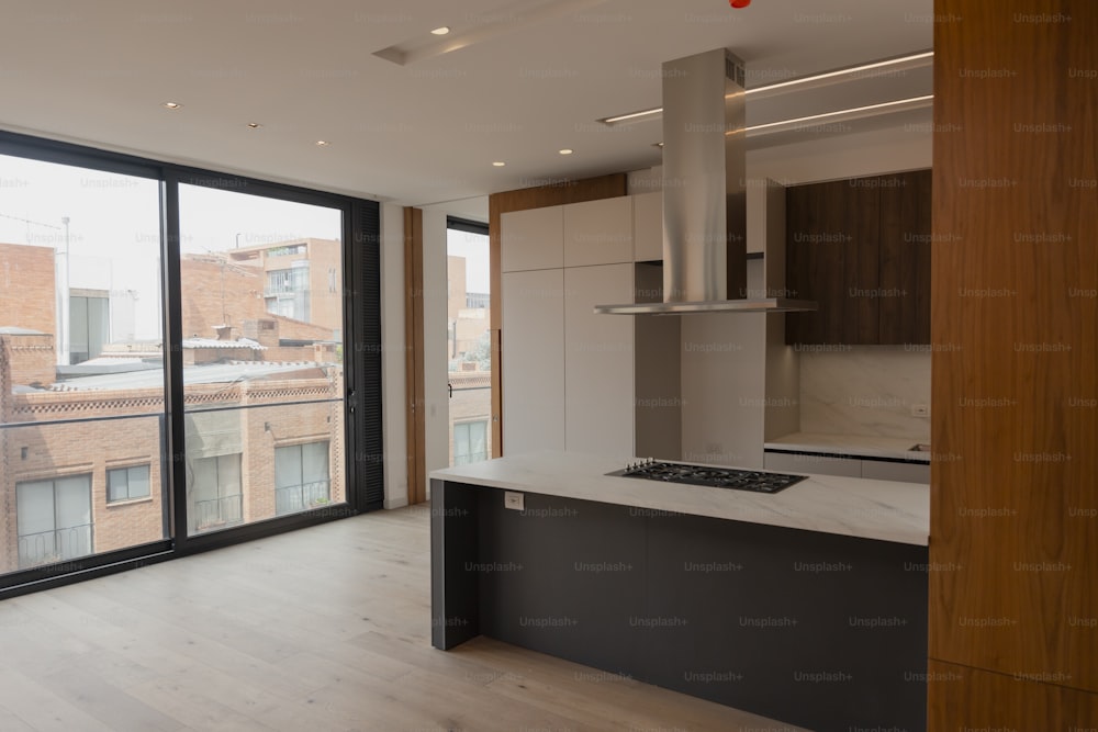 a kitchen with a stove top oven next to a window