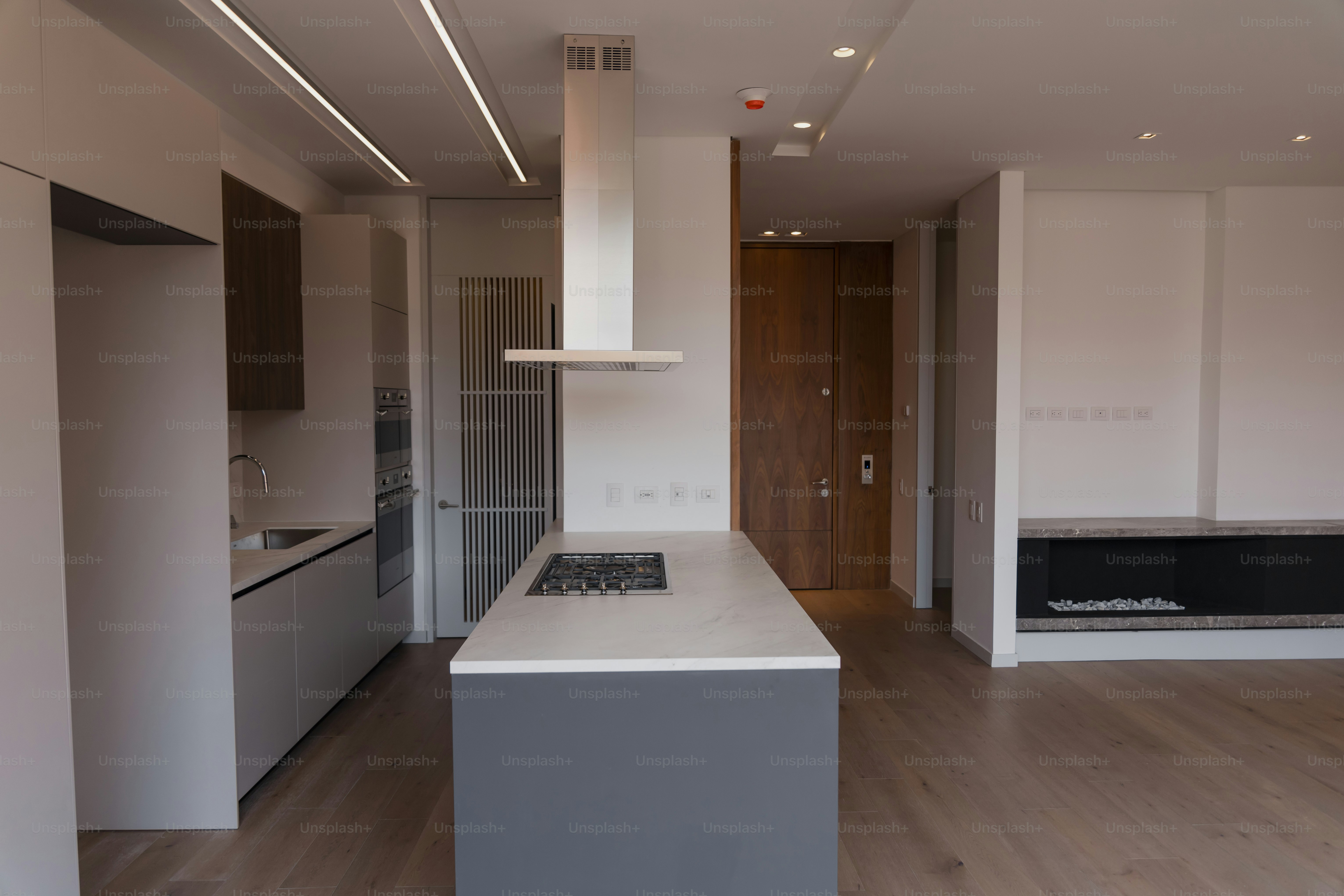 a kitchen with a stove top oven next to a counter