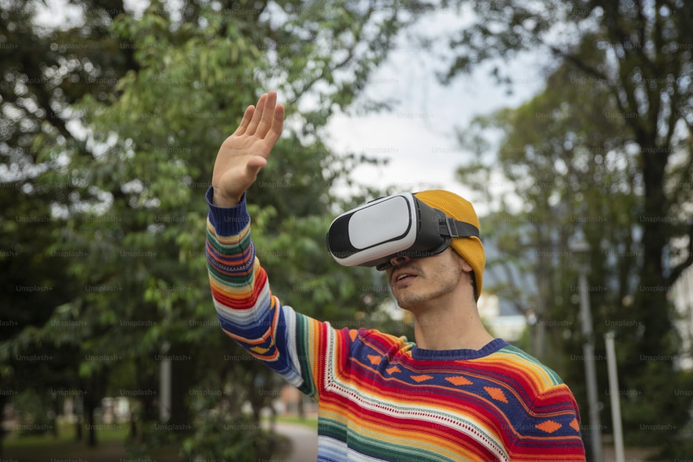 a man in a colorful shirt wearing a pair of virtual glasses