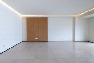 a large empty room with a wooden door