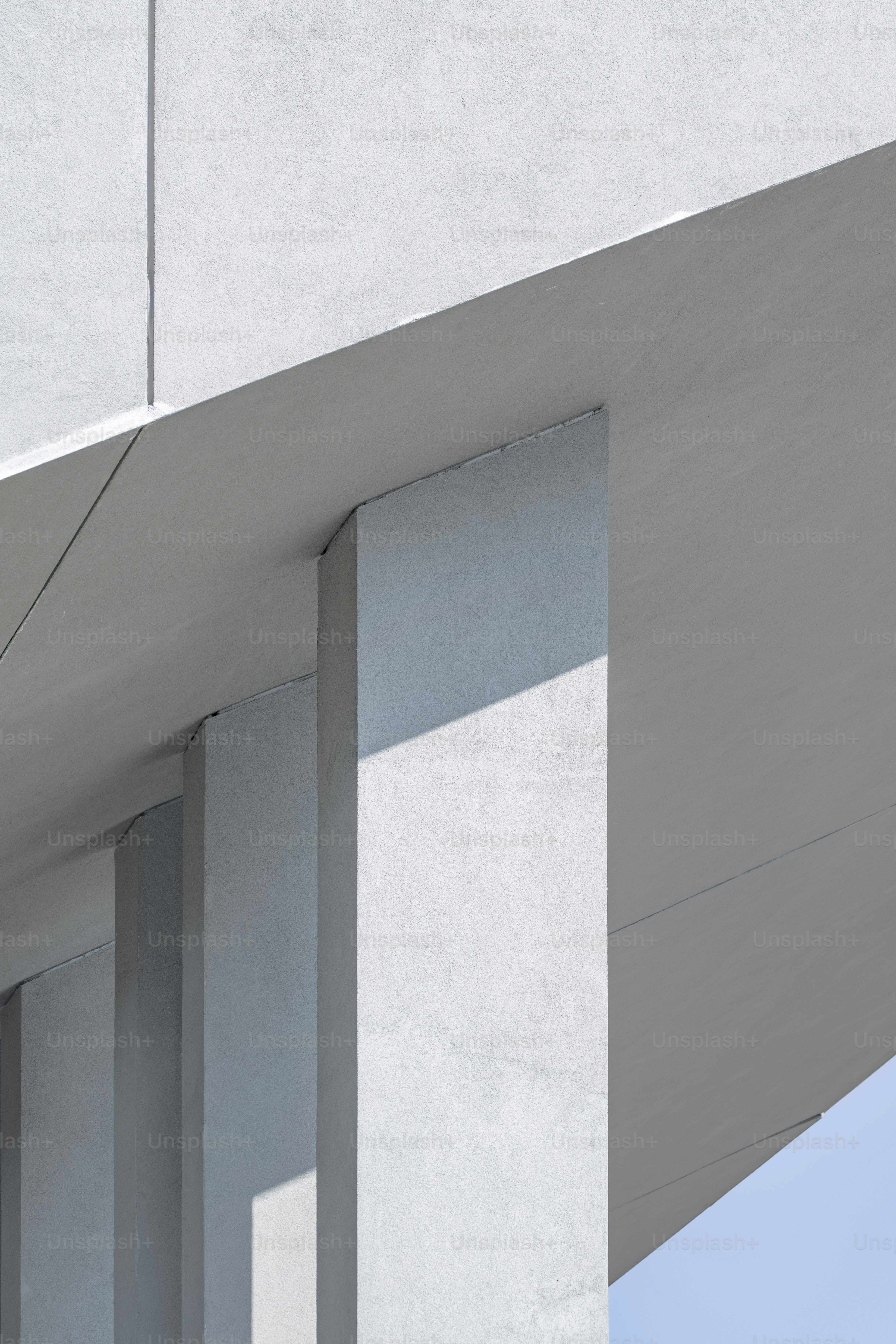 a bird is perched on the side of a building