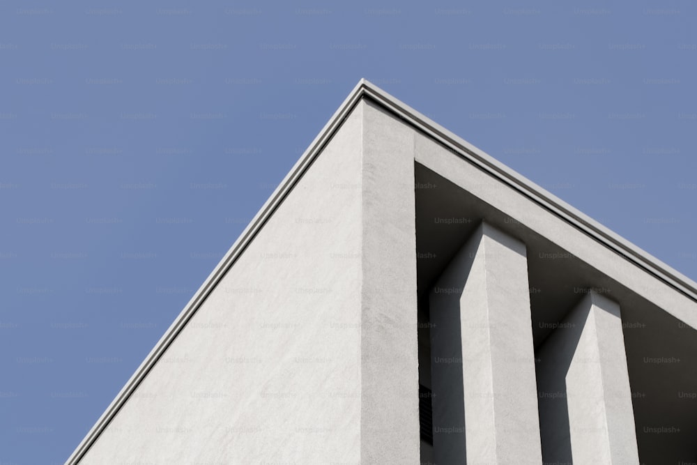 the corner of a building with a blue sky in the background