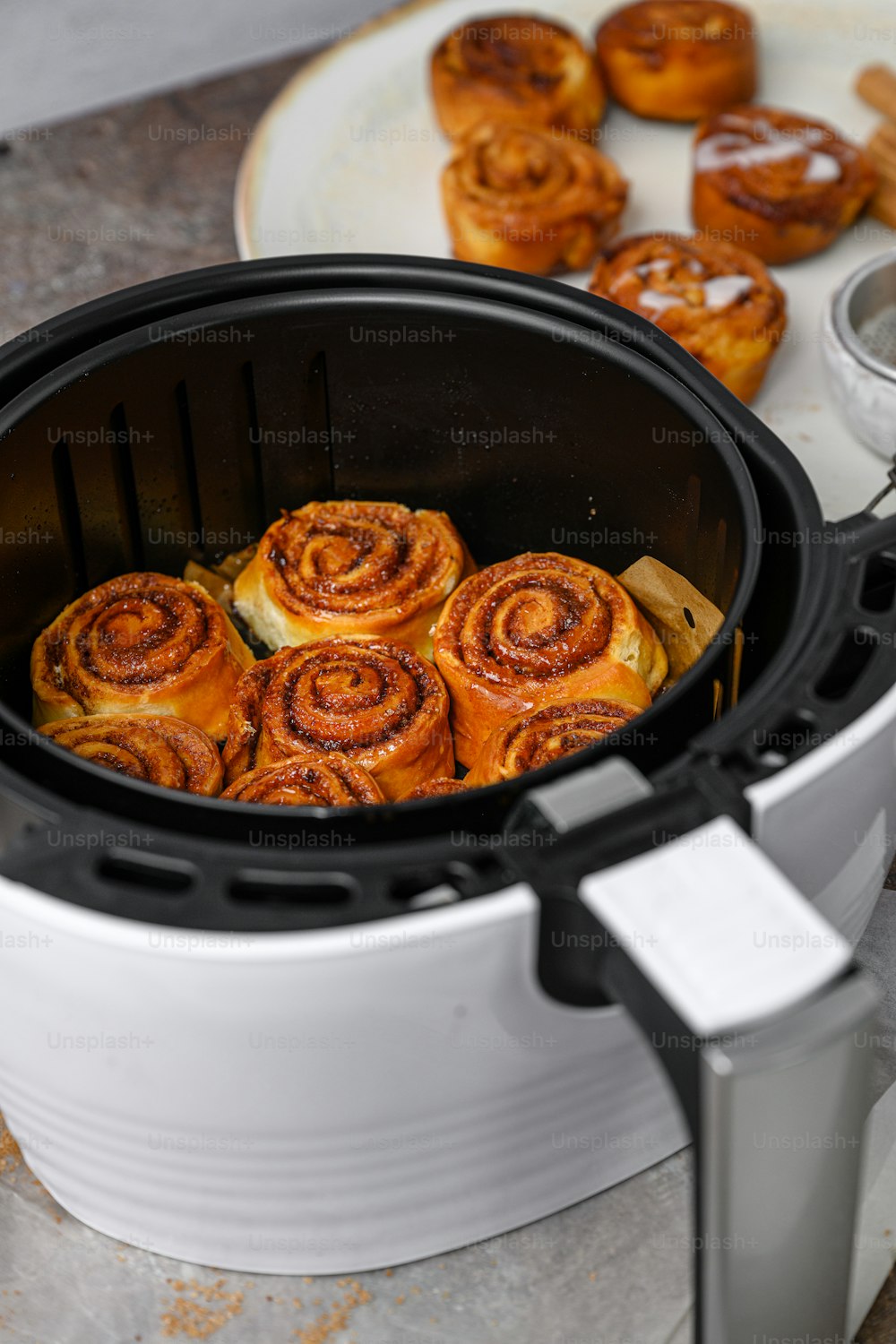 a bunch of doughnuts that are inside of a slow cooker