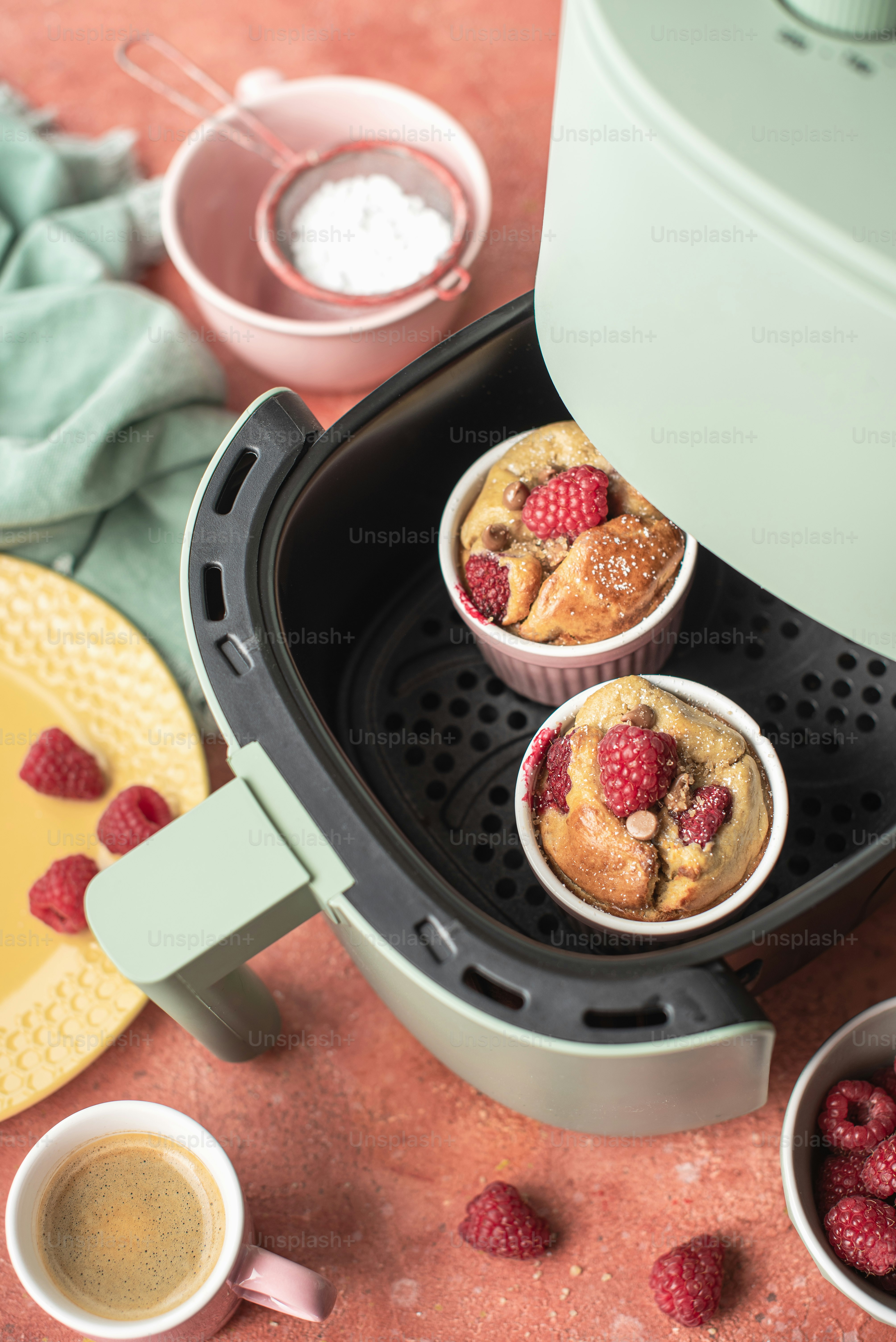a couple of muffins sitting inside of a coffee maker
