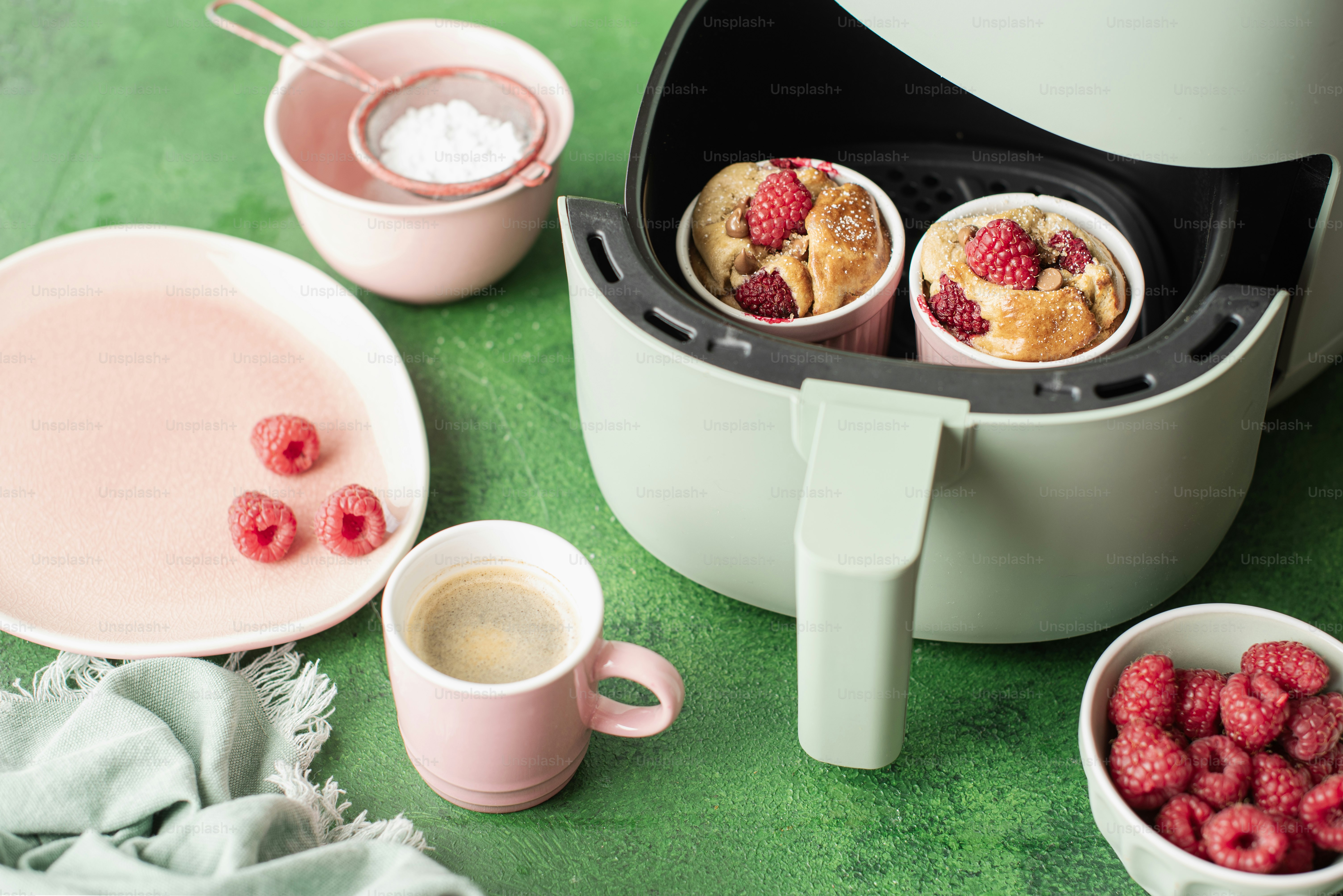 a close up of a plate of food with raspberries