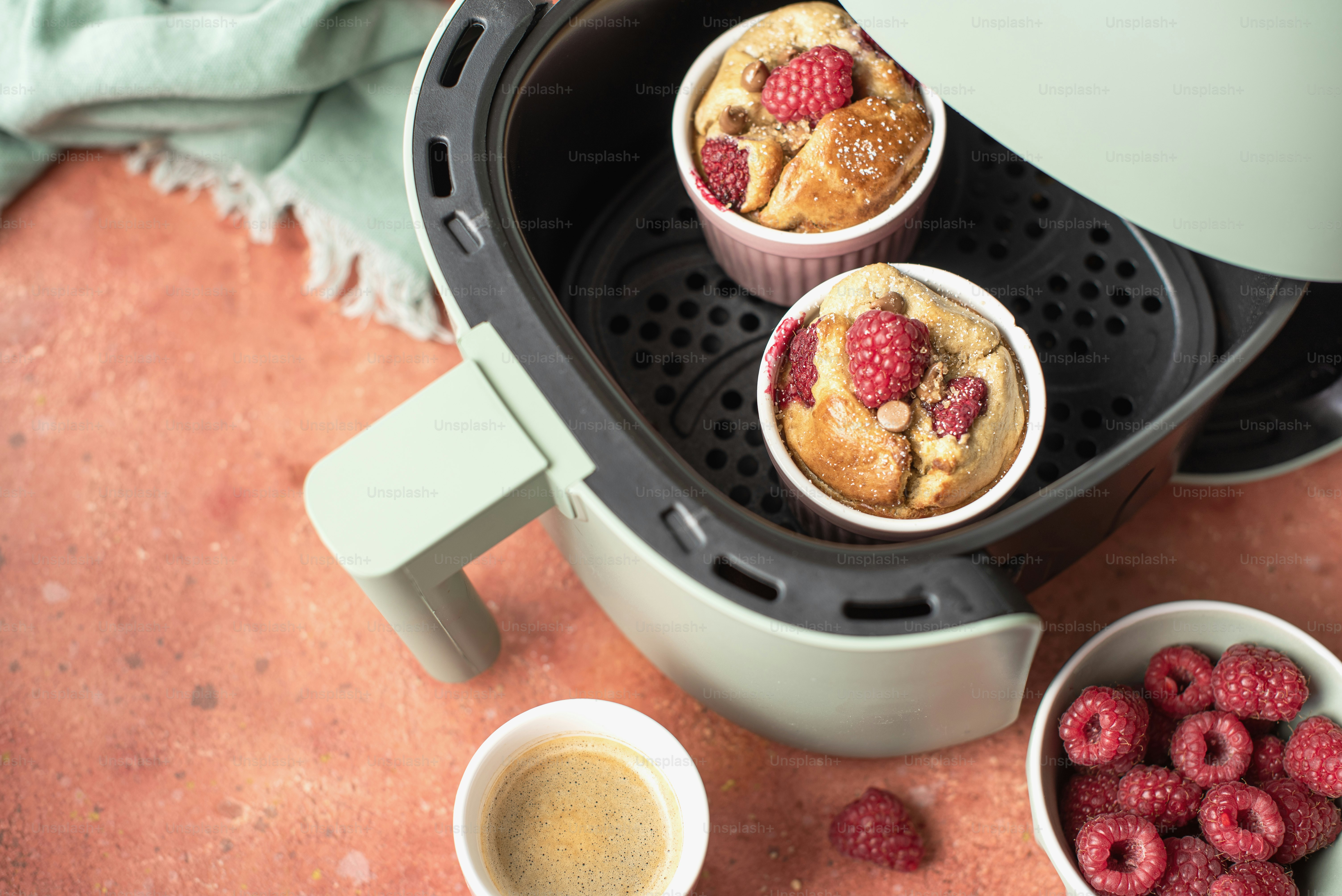 a couple of muffins sitting inside of a juicer