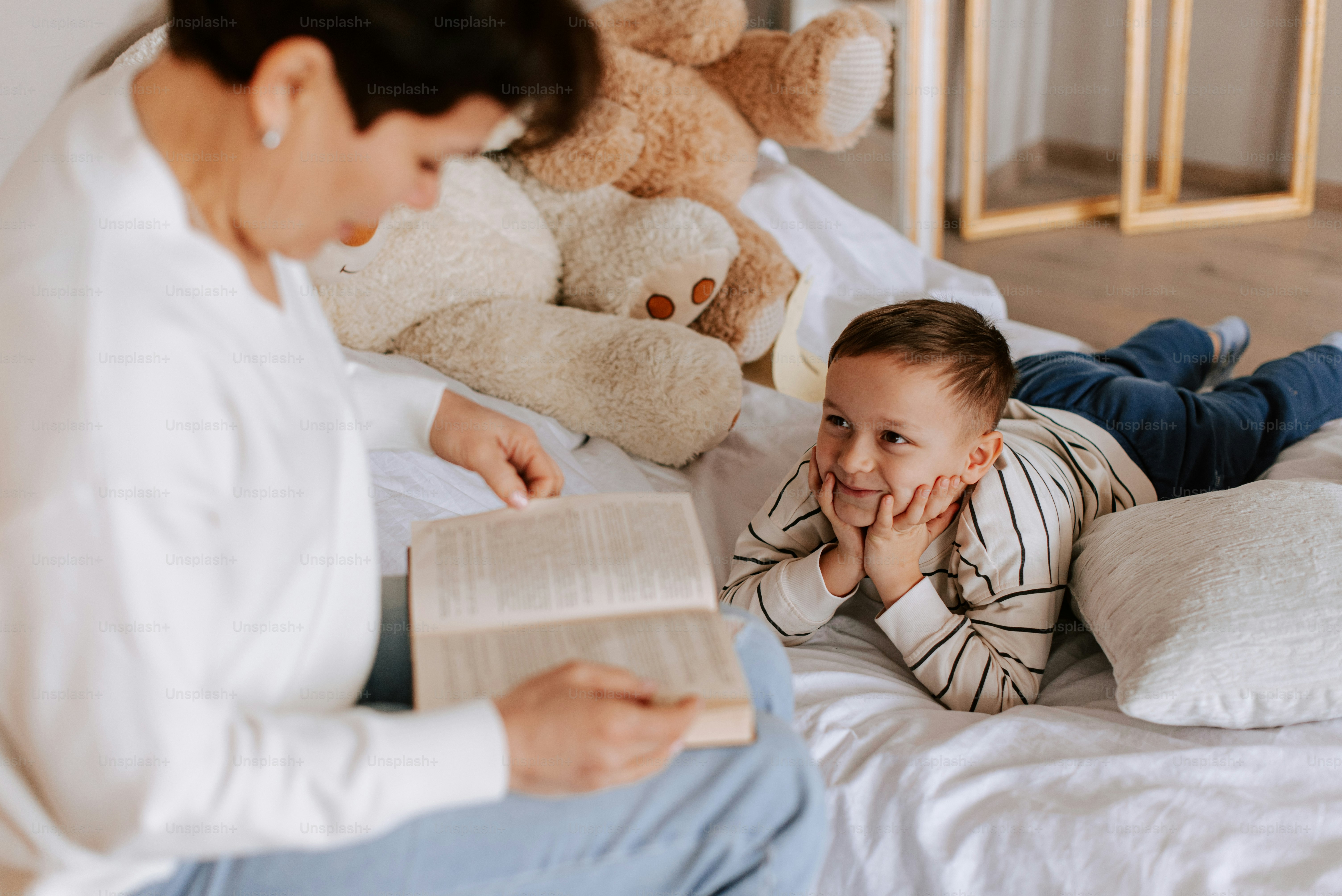Child reading a bedtime story with parent