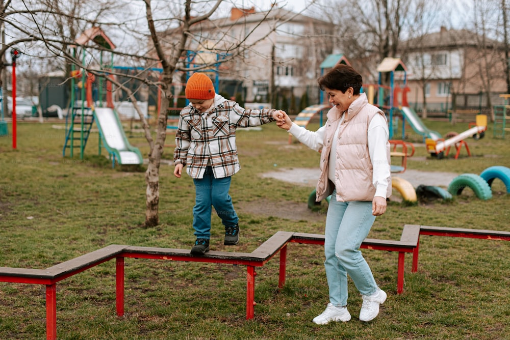 a couple of kids playing in a park