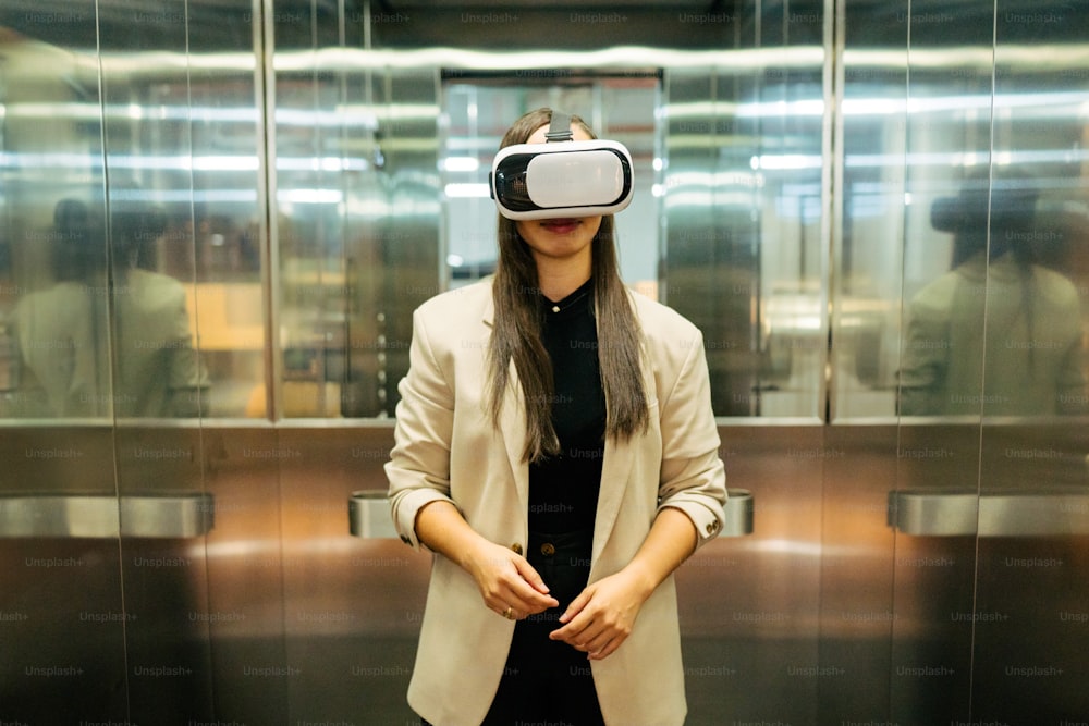 a woman standing in a elevator wearing a virtual headset