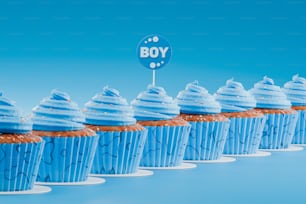 a row of blue cupcakes with frosting on top