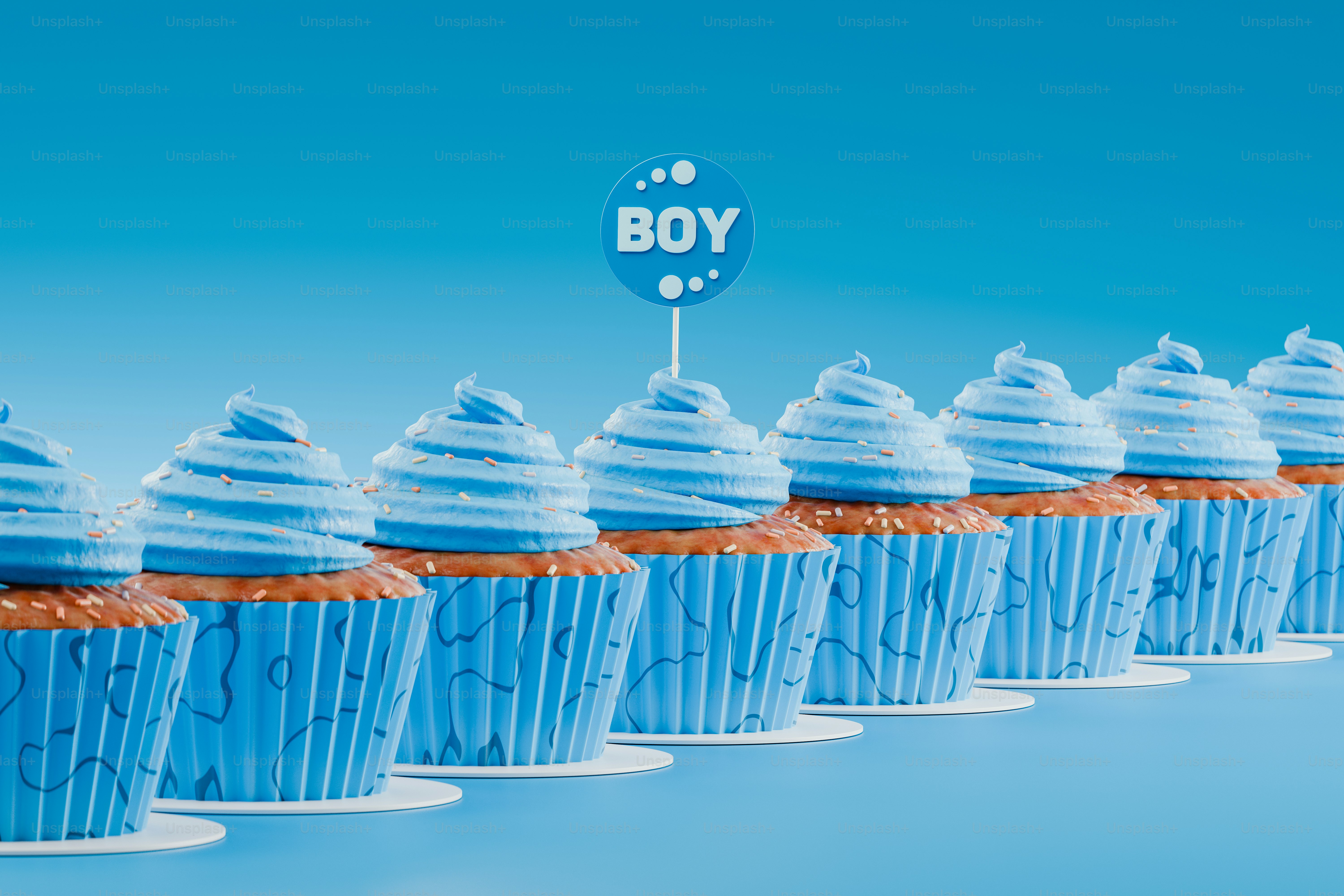 a row of blue cupcakes with frosting on top