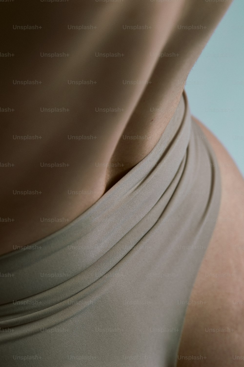 a close up of a woman's butt with a cell phone in her hand