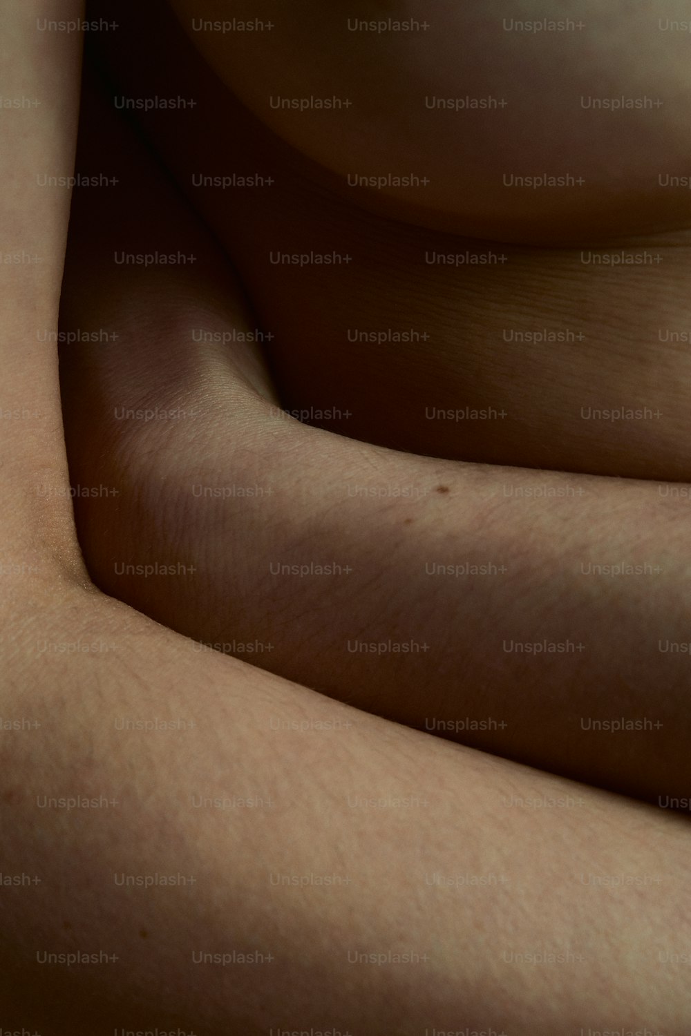 a close up of a person's arm with no shirt on