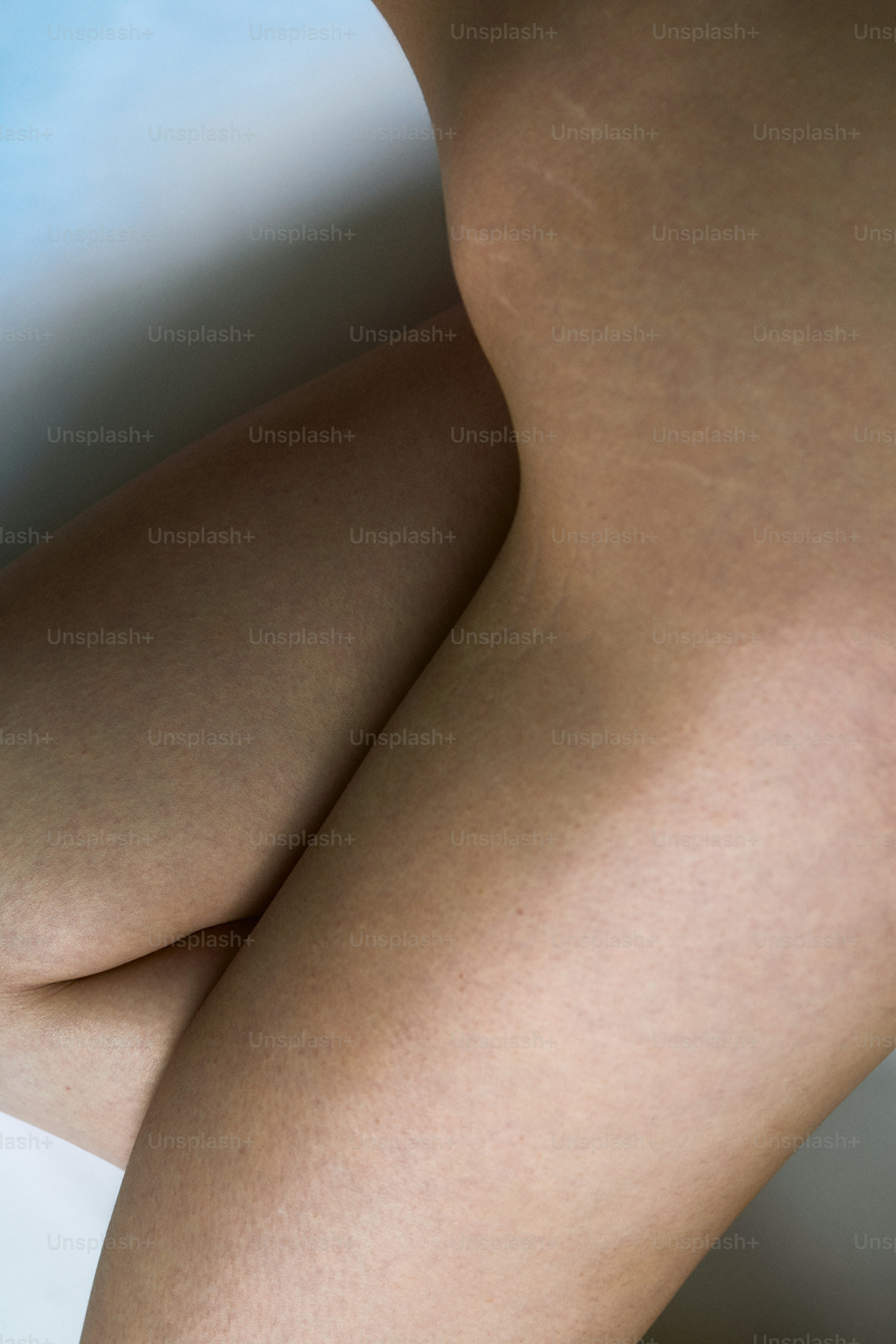 a close up of a person's legs with no shoes on