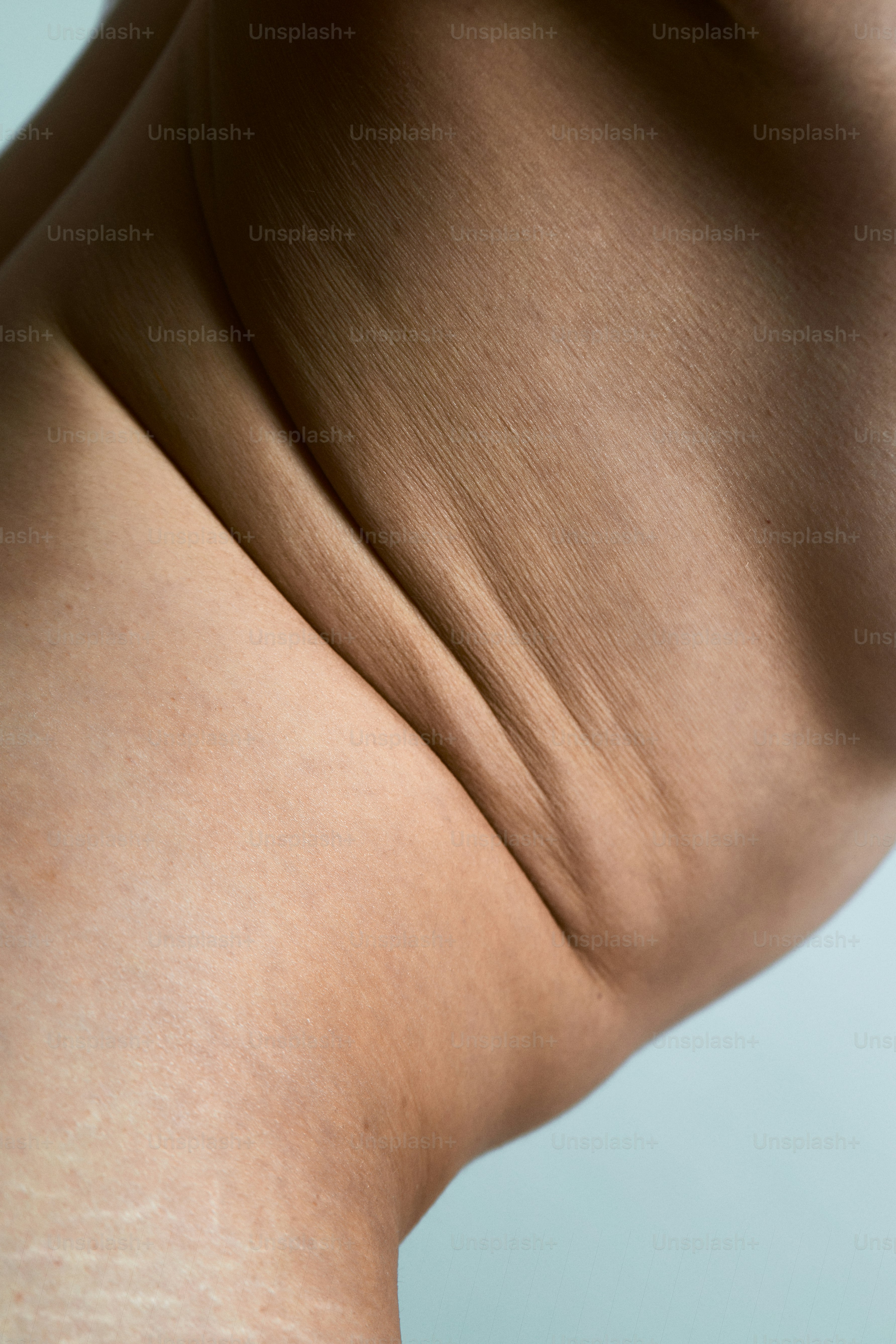 a woman's back with a lot of wrinkles