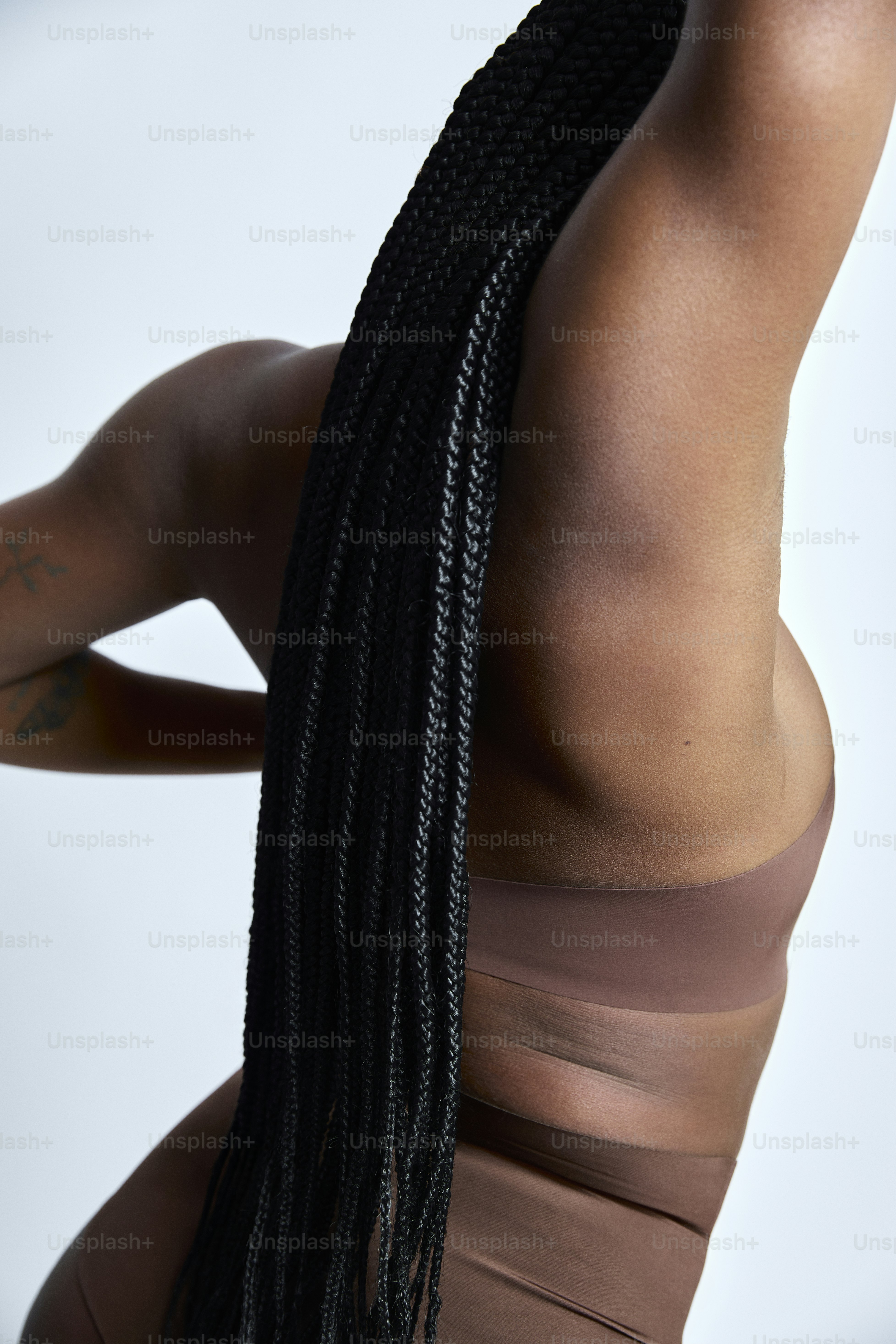 a woman with a very long black braid in her hair