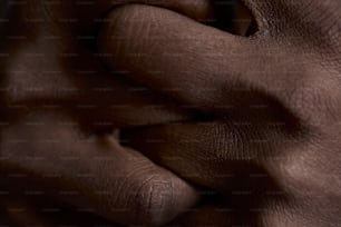 a close up of a person's hand holding something