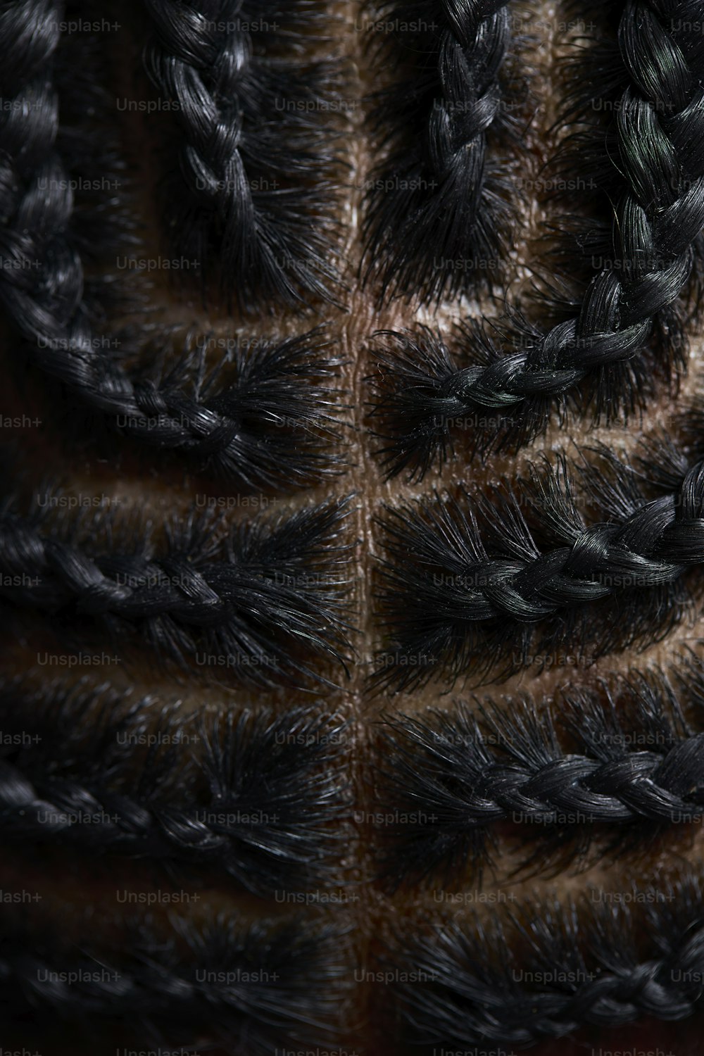 a close up of a black and brown coat