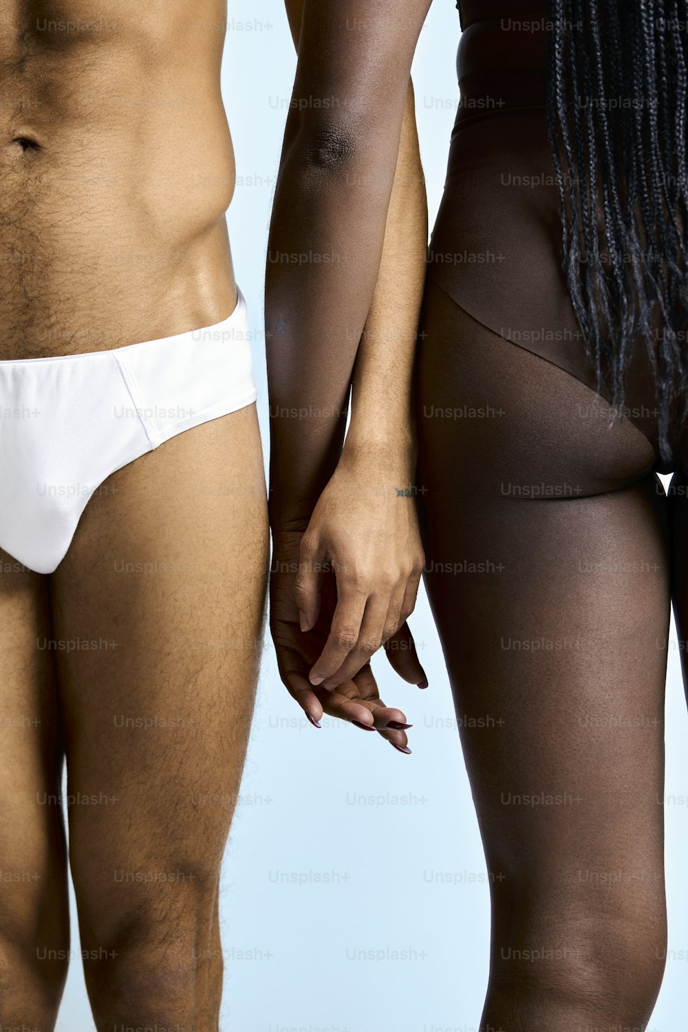 a man and a woman in white underwear