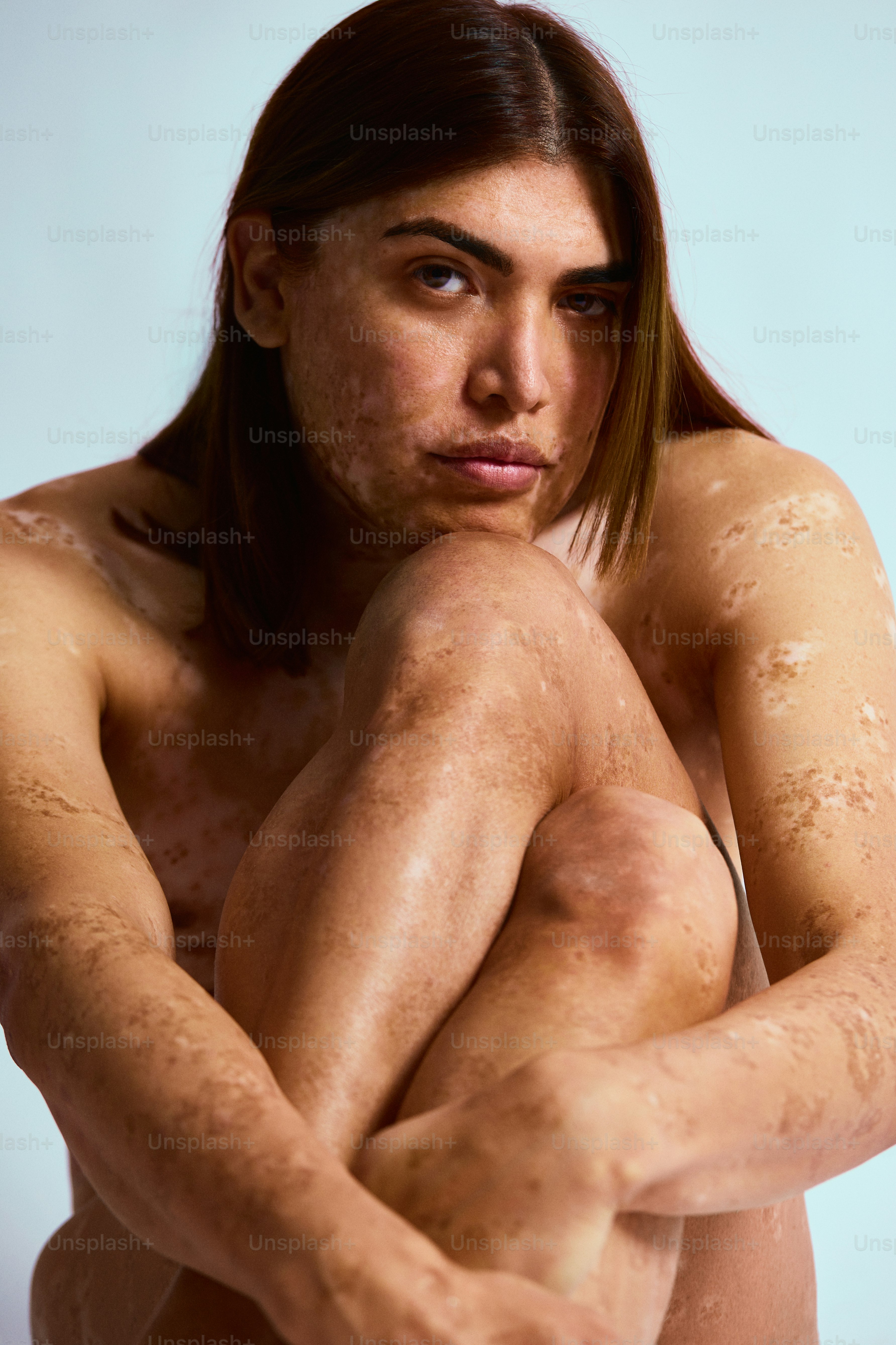 a woman with a lot of dirt on her body