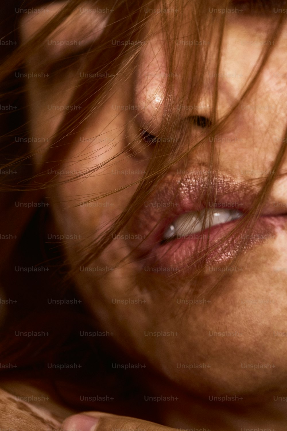 a close up of a woman brushing her teeth