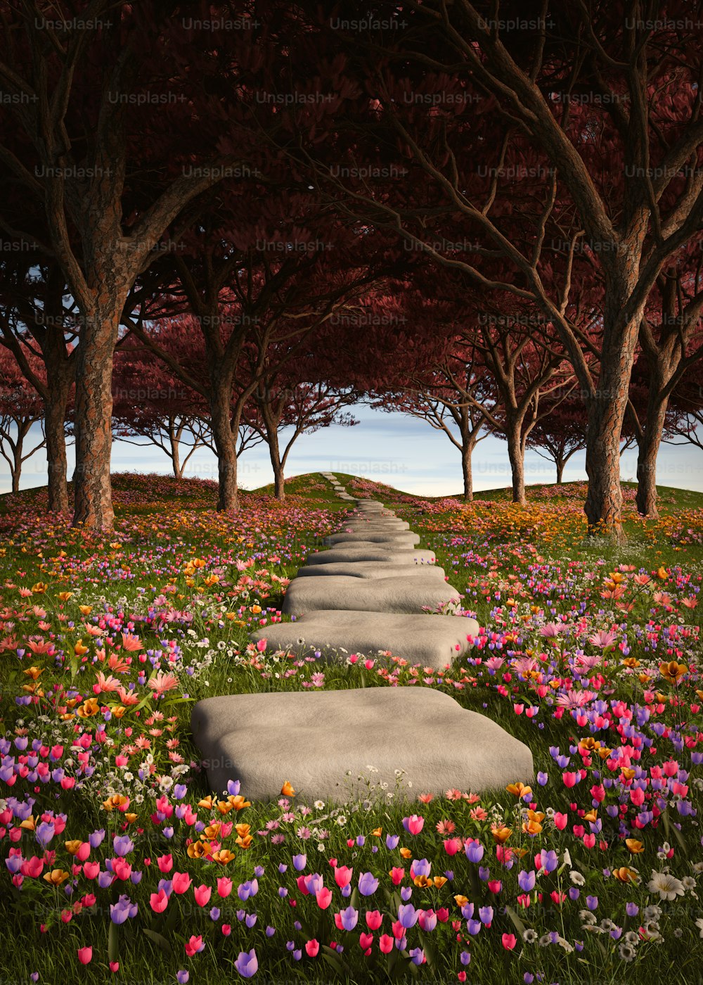 Un camino de piedra rodeado de flores y árboles