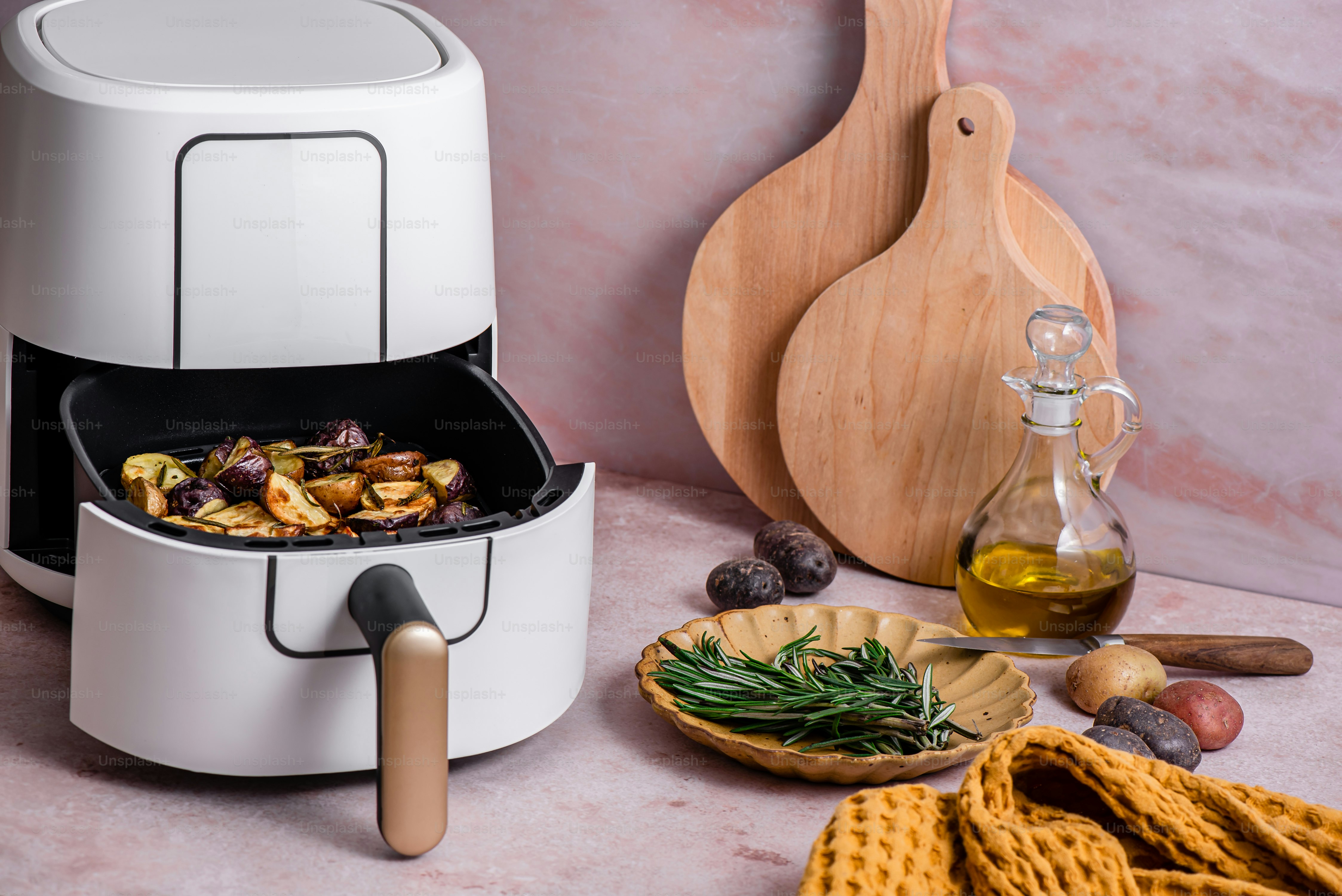 a food processor sitting on top of a counter next to a plate of food