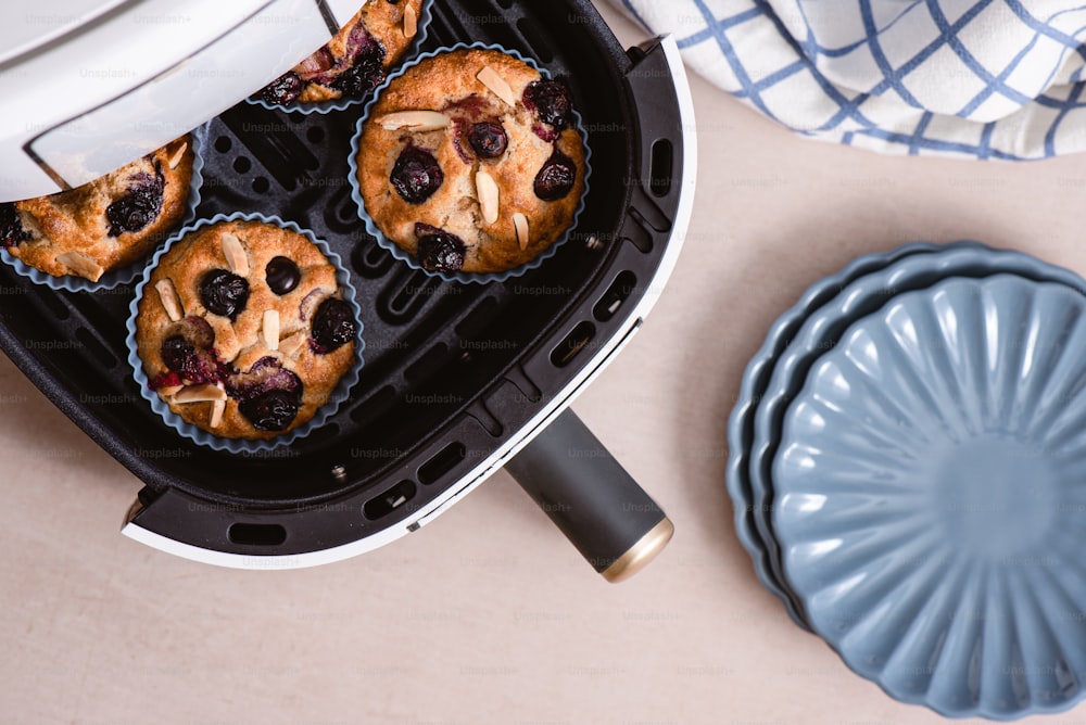 blueberry muffins are being cooked in a toaster