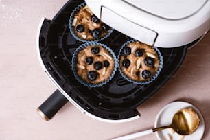 a couple of muffins sitting on top of a pan