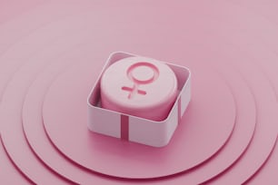 una scatola rosa con un simbolo femminile
