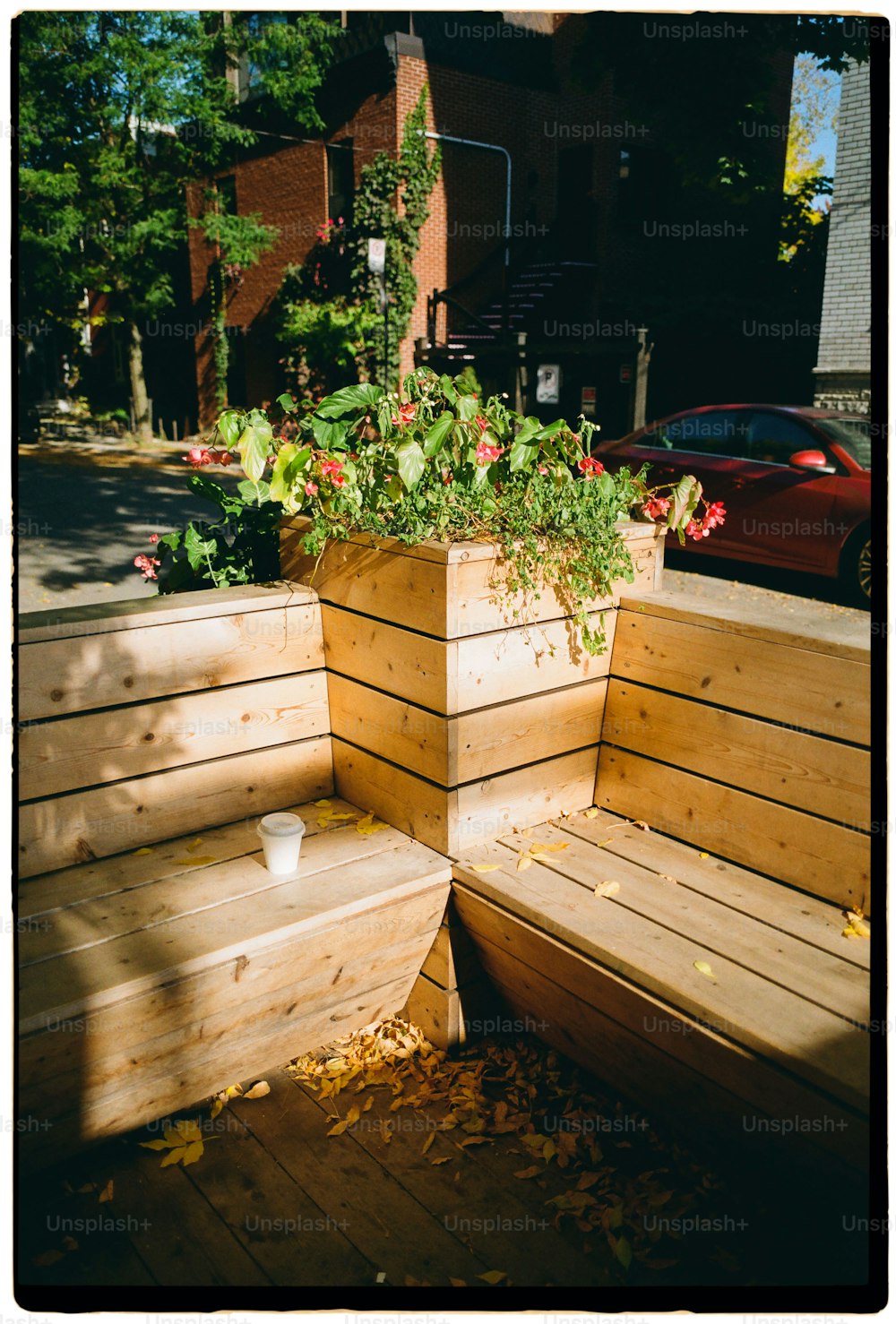 a couple of wooden benches sitting next to each other