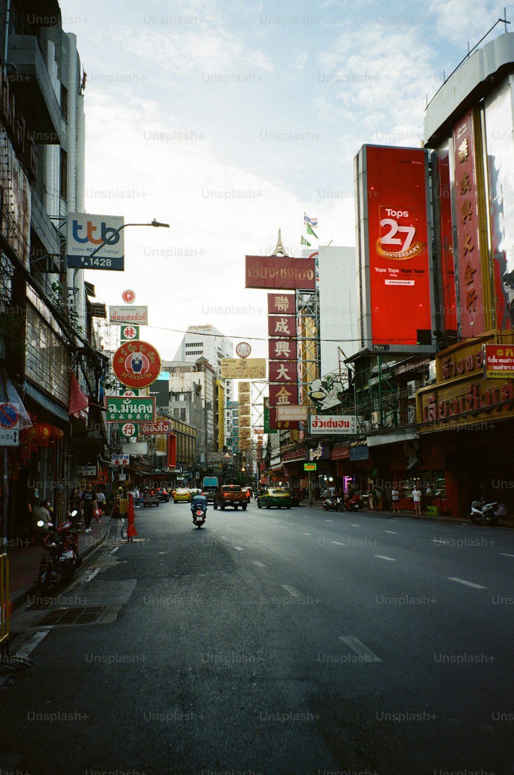 a city street filled with lots of tall buildings