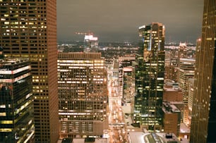 a view of a city at night from the top of a building