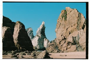 a large rock formation in the middle of a desert