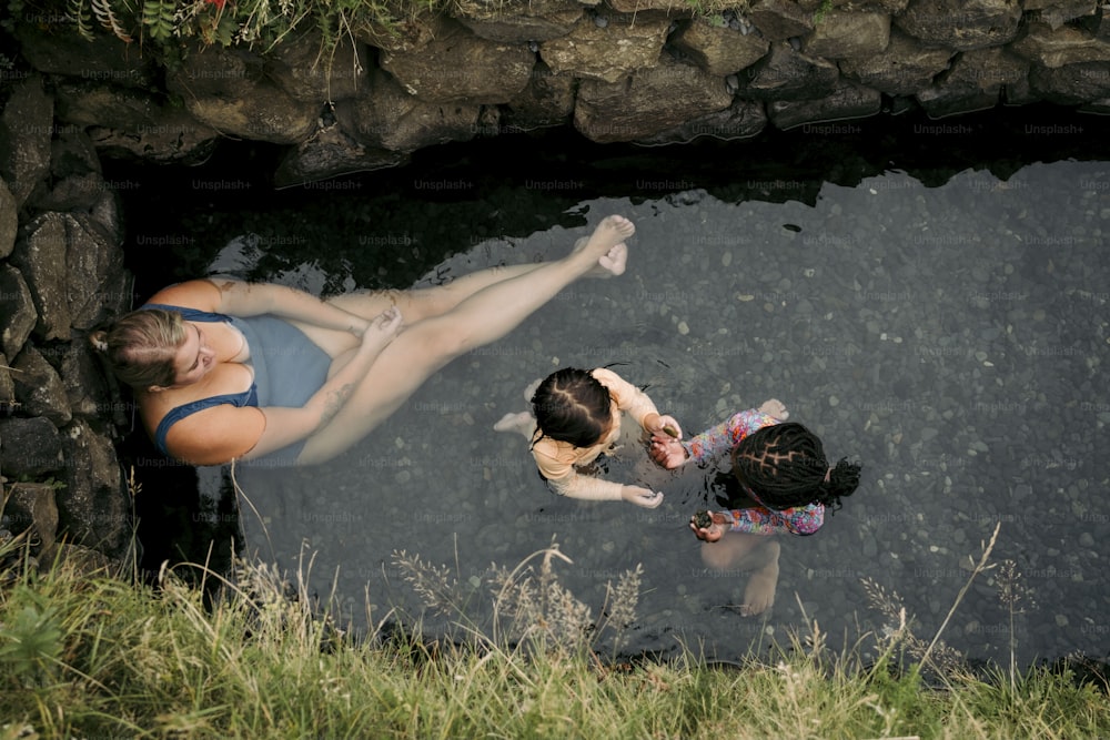 a couple of people that are in the water