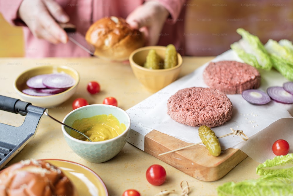 a person preparing food on a cutting board