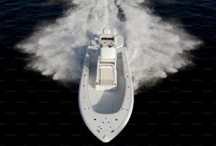 a motor boat speeds through the water