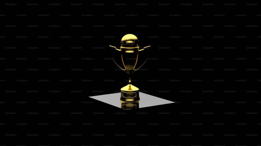 a golden trophy sitting on top of a table