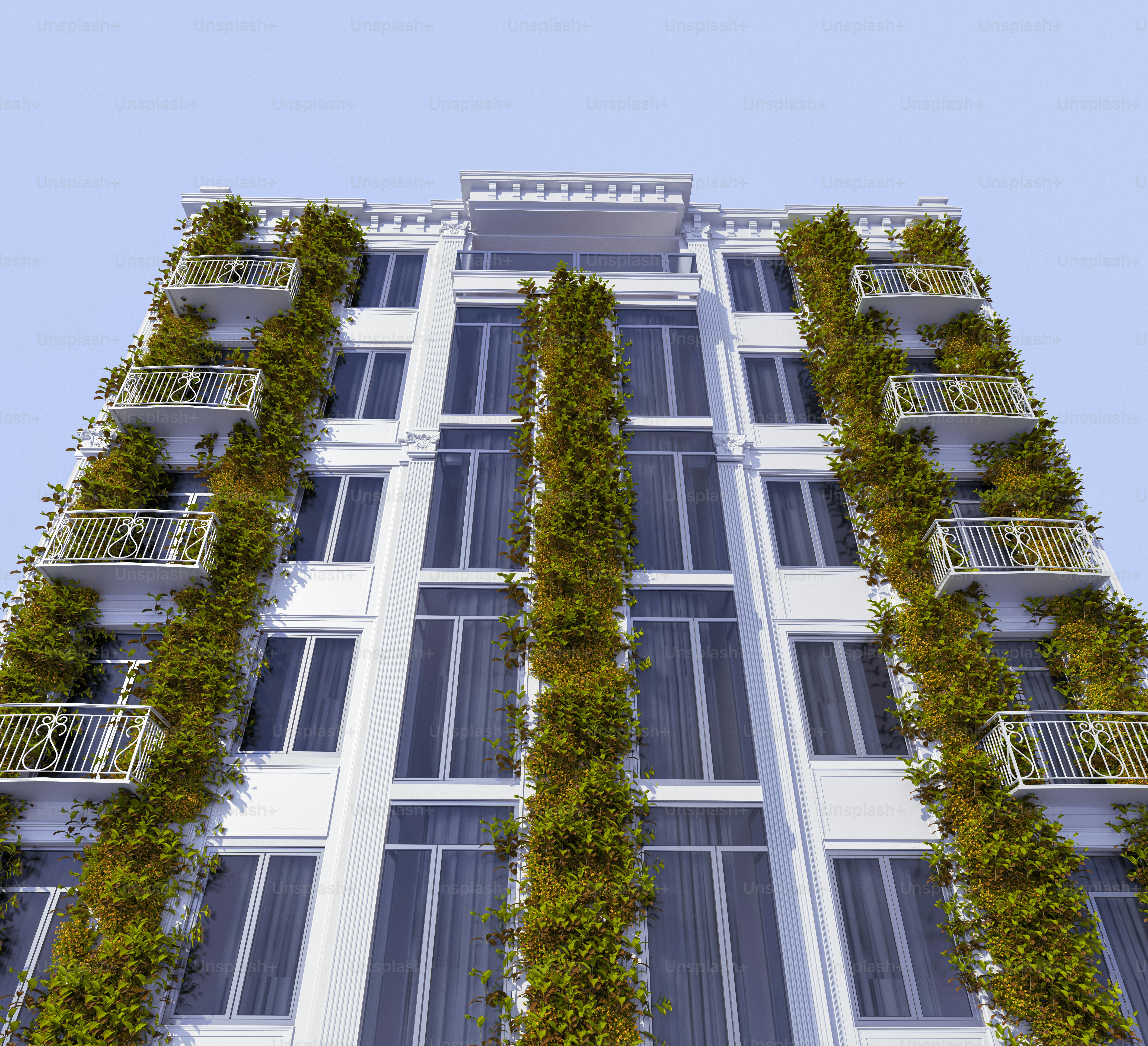a very tall building with a bunch of plants growing on it