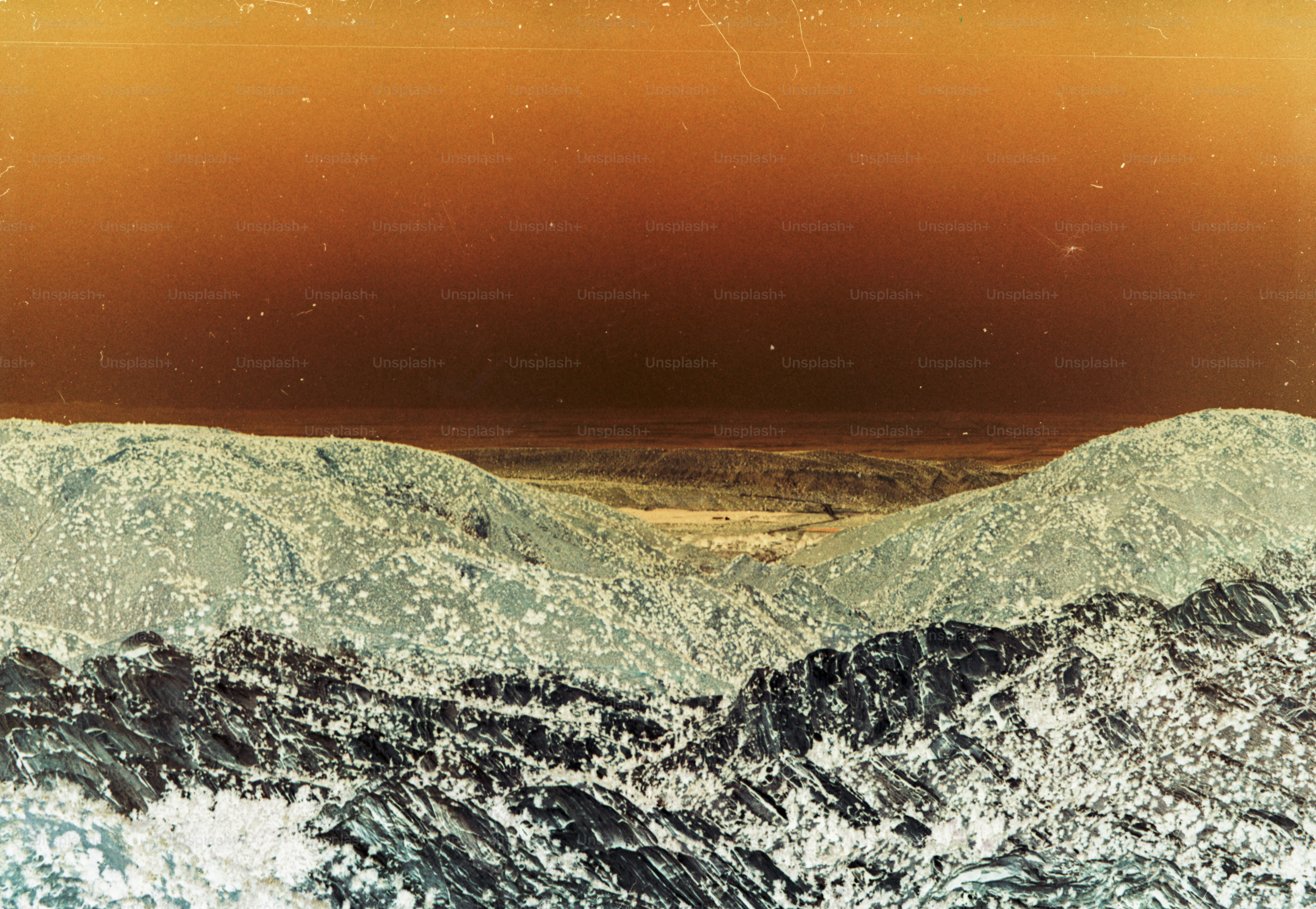 a man riding a snowboard on top of a snow covered slope