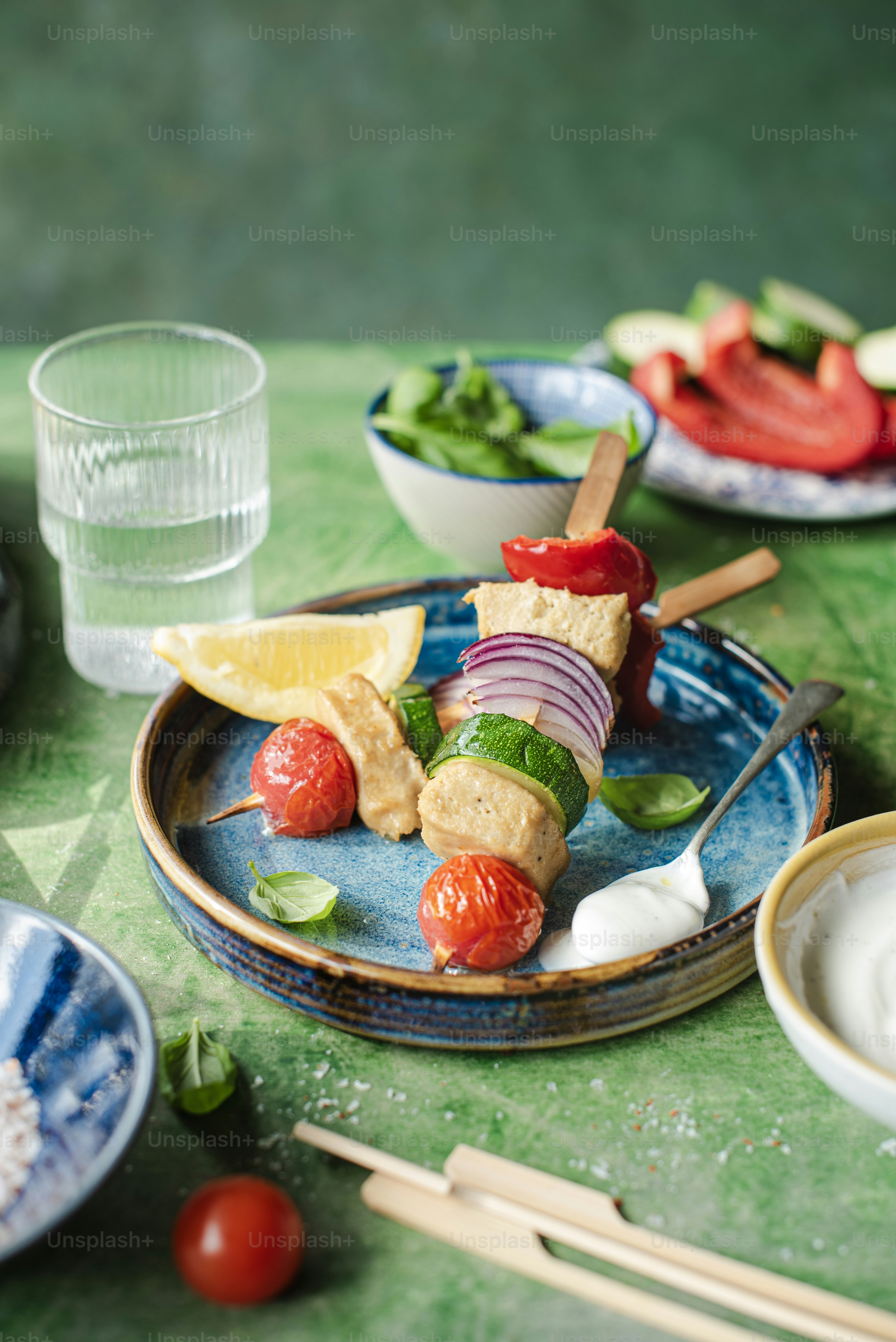 a plate of food on a table with chopsticks