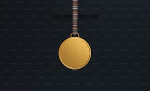 a gold medal hanging on a black wall