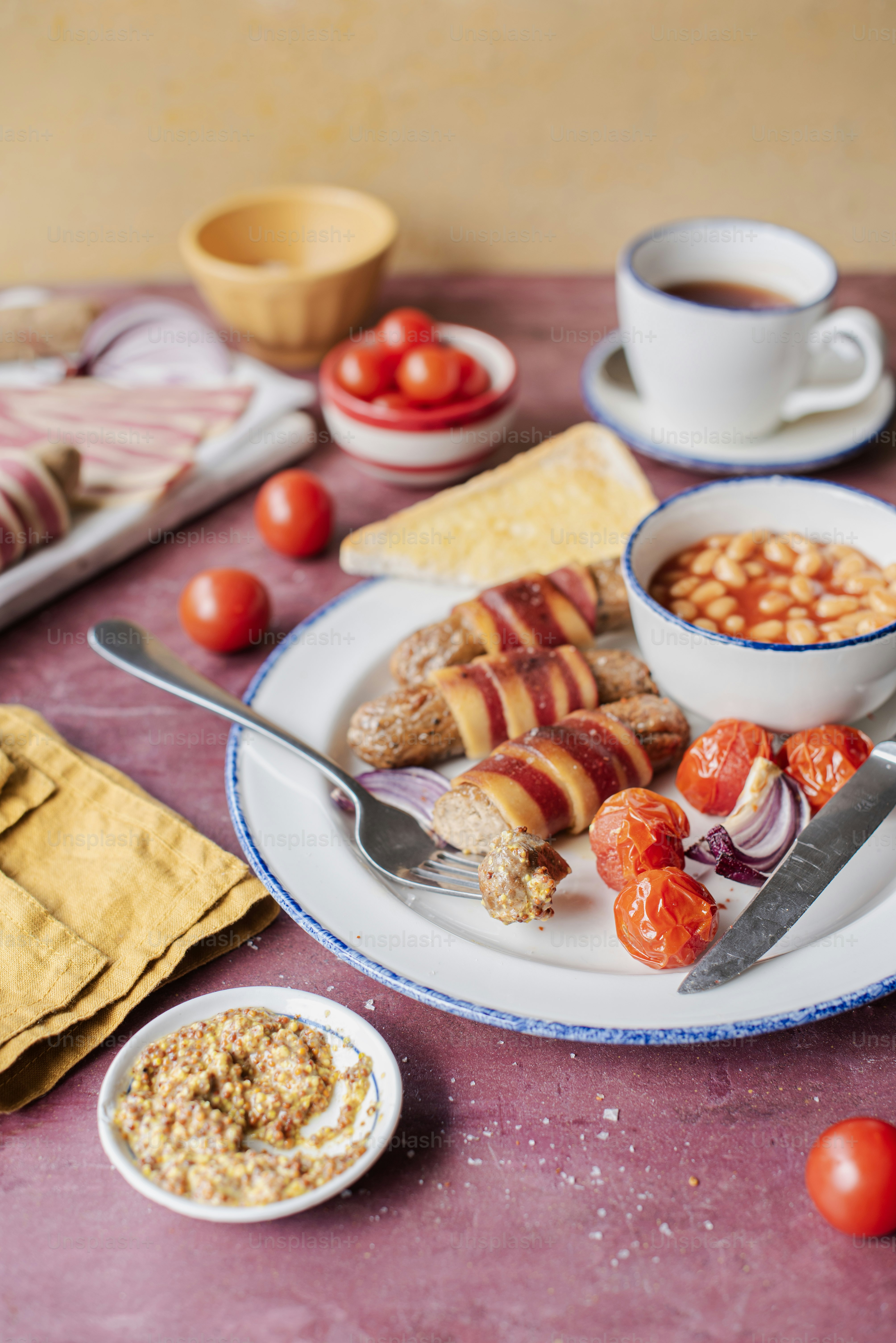 a plate of food on a table next to a bowl of soup