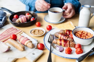 a table topped with plates of food and cups of coffee