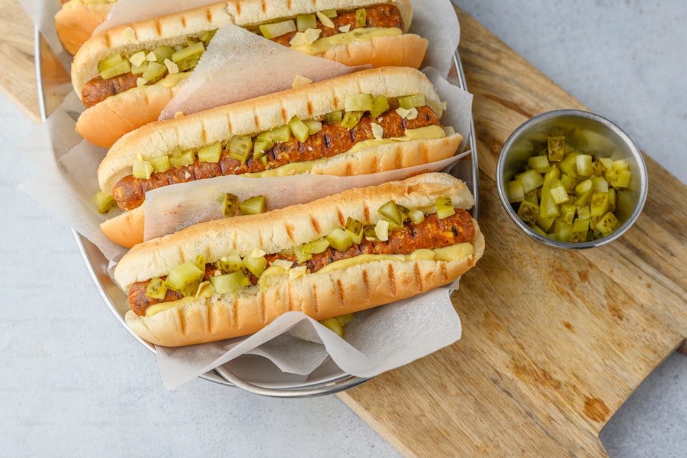 a bunch of hot dogs that are on a tray