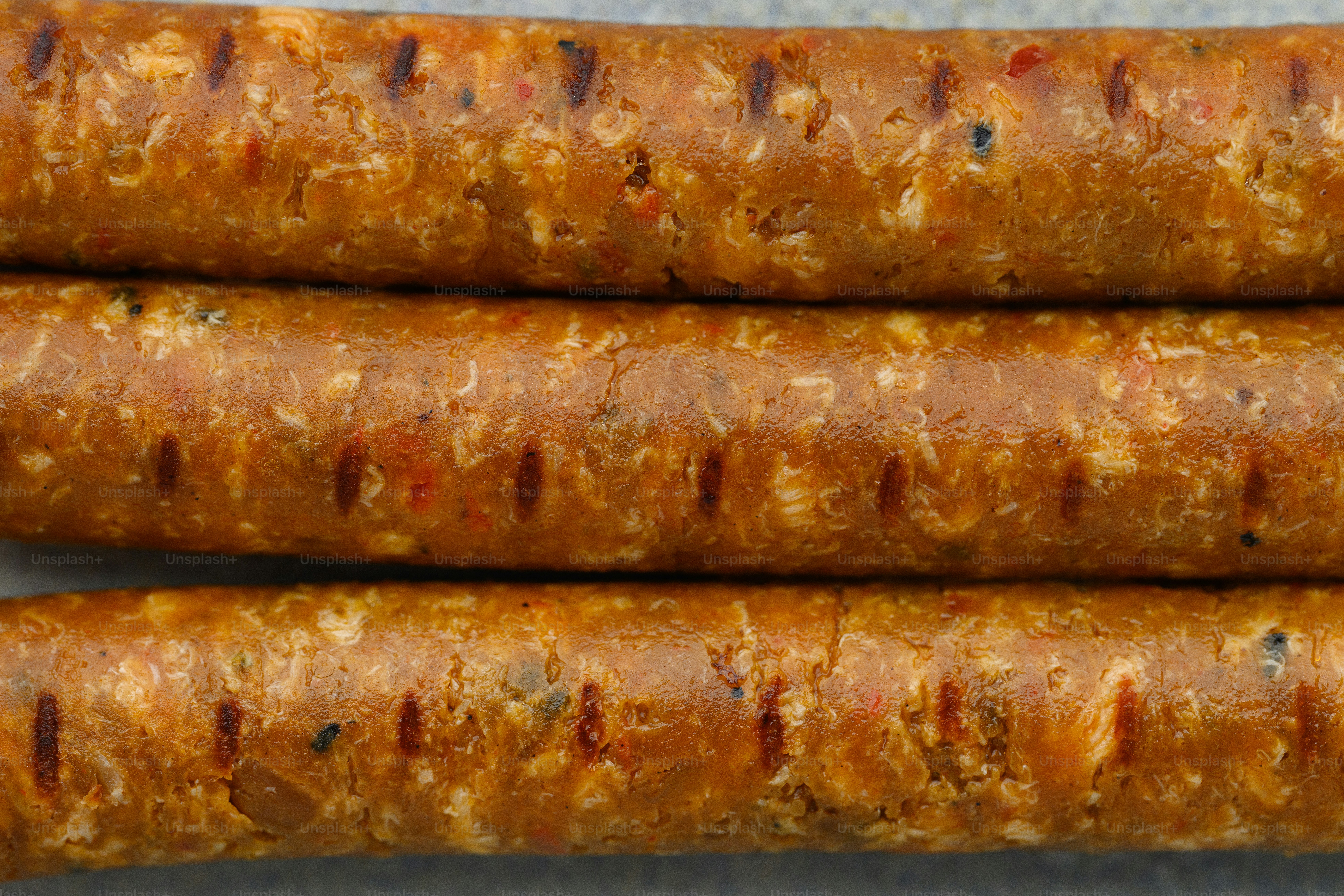 a close up of two sausages on a table